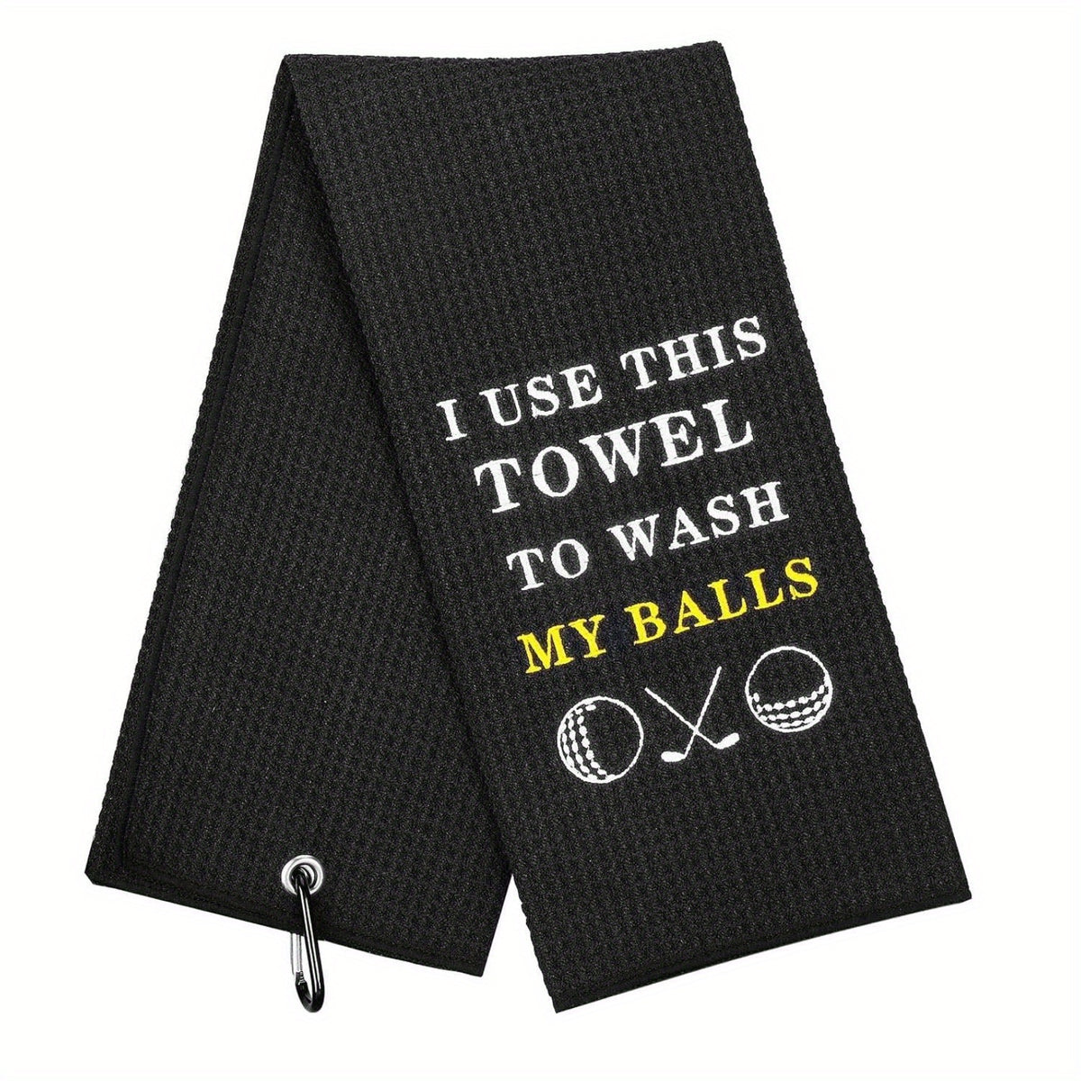 Black golf towel with white and yellow embroidered text and icons, featuring a clip for attaching to a golf bag.